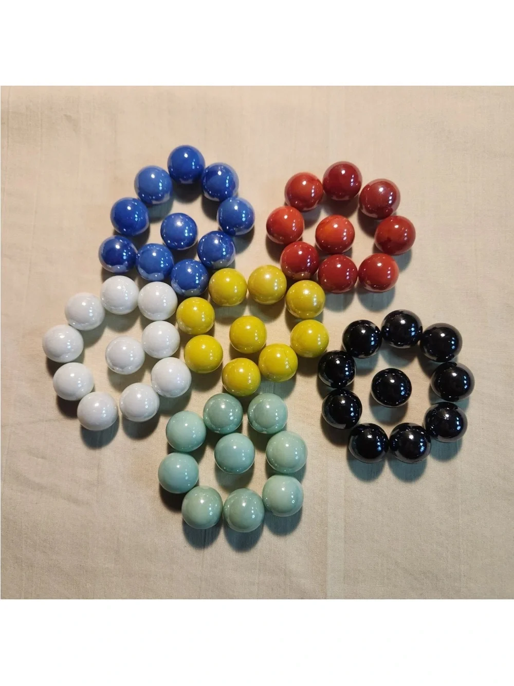 Set of 57 solid-color replacement glass marbles, 6 colors,